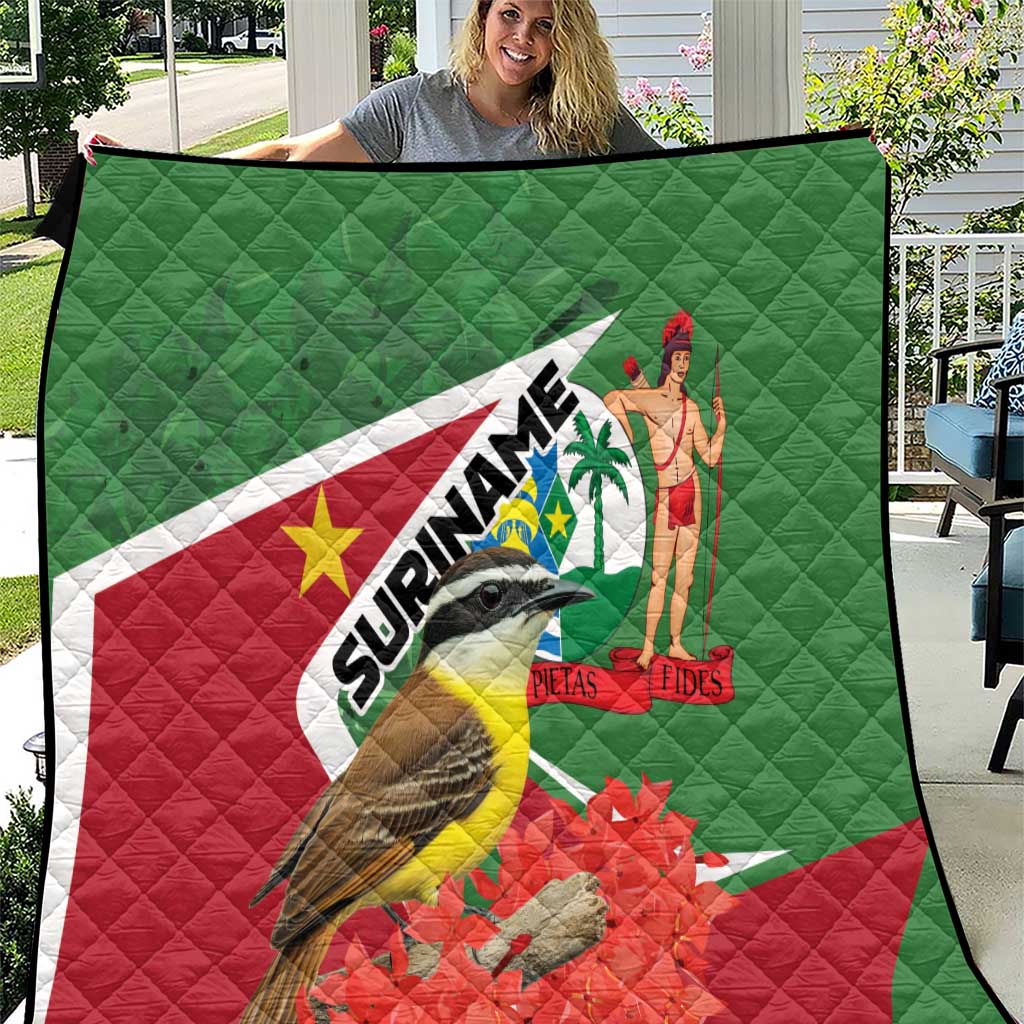 Suriname flag quilt in green, red, and white with bird, palm figure, and SURINAME text