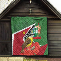 Suriname flag quilt hanging with bird artwork, red flowers, palm figure, SURINAME text
