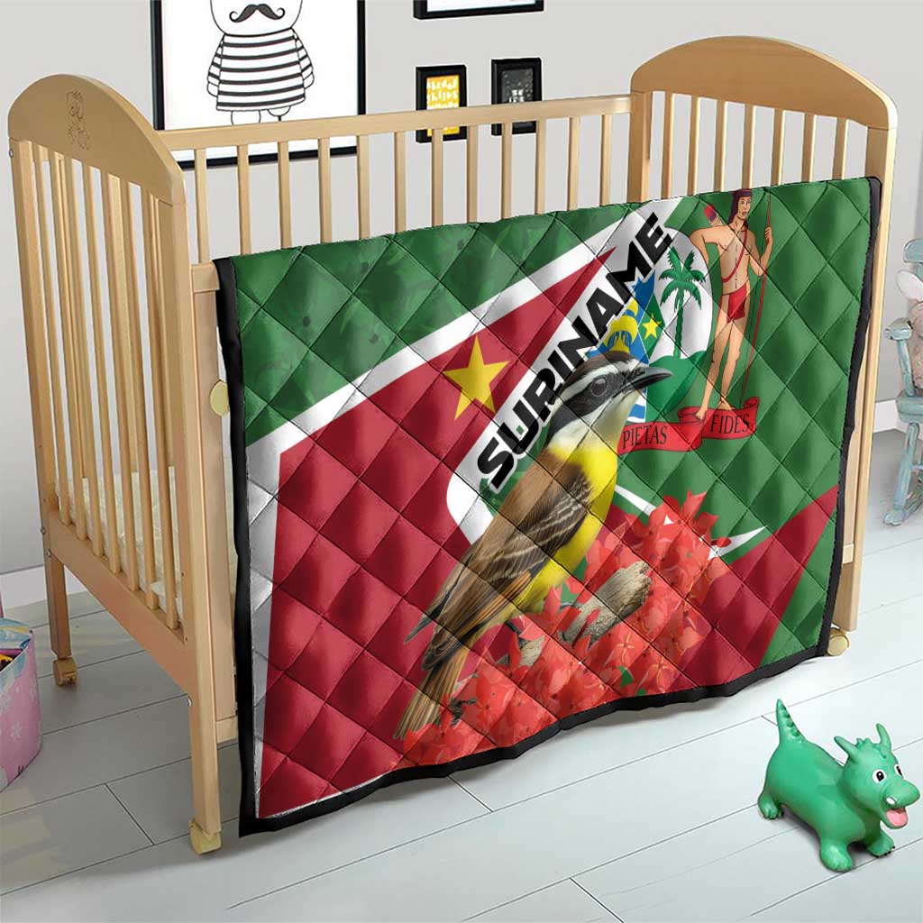 Suriname flag quilt on wooden crib with bird graphic, palm dancer, and red flower design