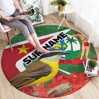 Round Suriname-themed area rug, red green with birds, palm tree, and star flag graphics
