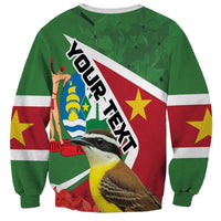 Green sweatshirt with bold Suriname flag design and bird graphic, long sleeves