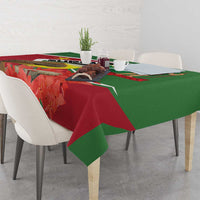 Suriname tablecloth with flag graphic, red floral leaves and green draped edge