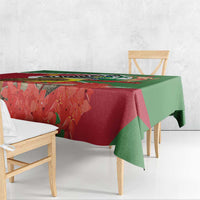 Suriname tablecloth corner drape showing bird and red floral motifs on green border