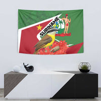 Flag-style Suriname tapestry with bird, red flowers, palm figure and green/red design