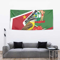 Suriname tapestry wall hanging with bird, red blossoms and palm-figure on green/red field