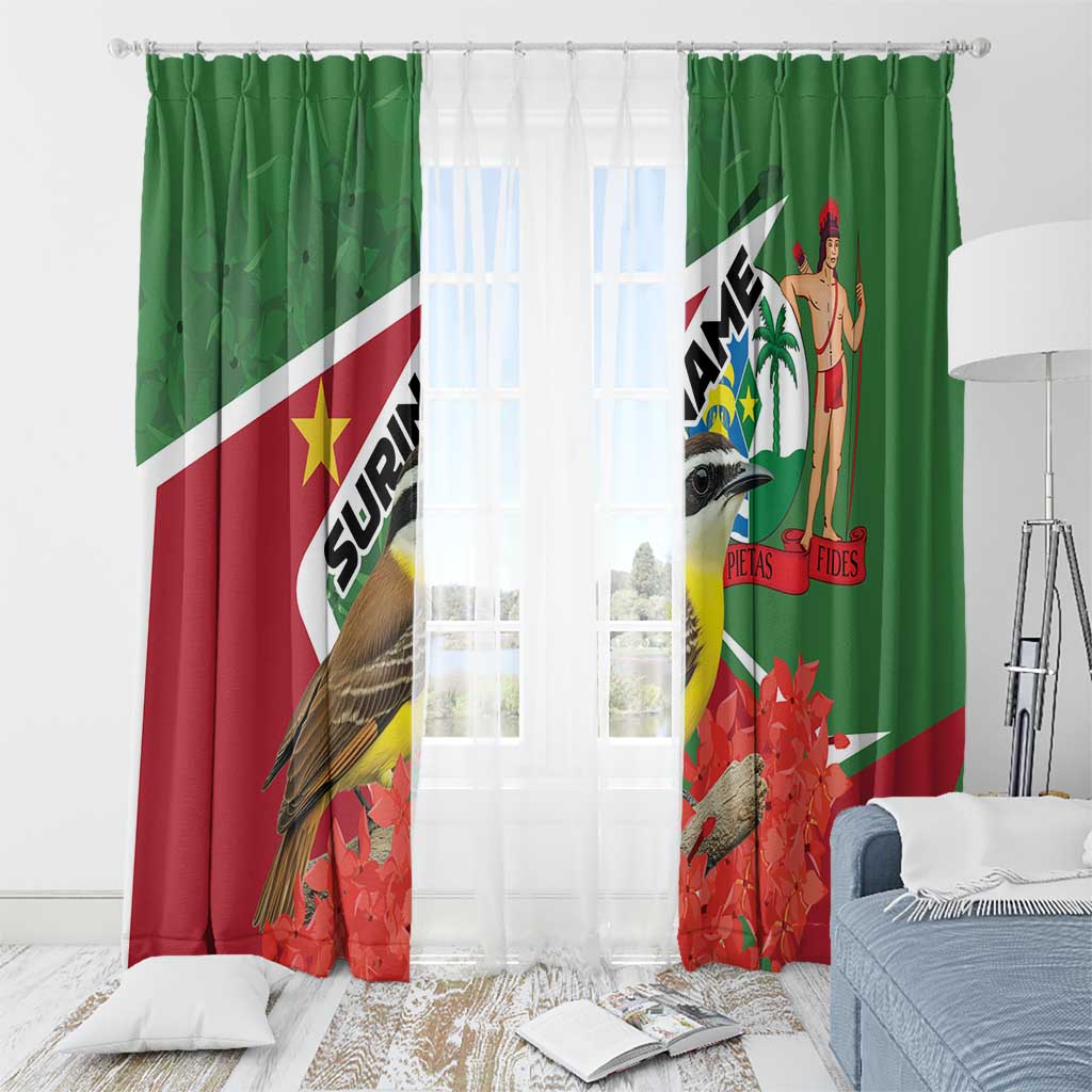 Green window curtains with bird and palm-figure print, with sheer inner curtain visible
