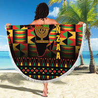 Round beach blanket featuring Kwanzaa menorah and African map, fringed white edge