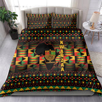 Kwanzaa bedding set on bed, black base with geometric stripes and kinara candle artwork