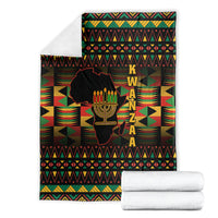 Folded Kwanzaa African throw blanket, black geometric pattern with kinara candle graphic