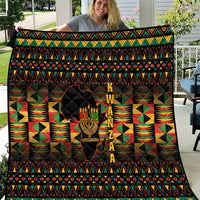 Kwanzaa festival quilt with black geometric pattern border and kinara candle center