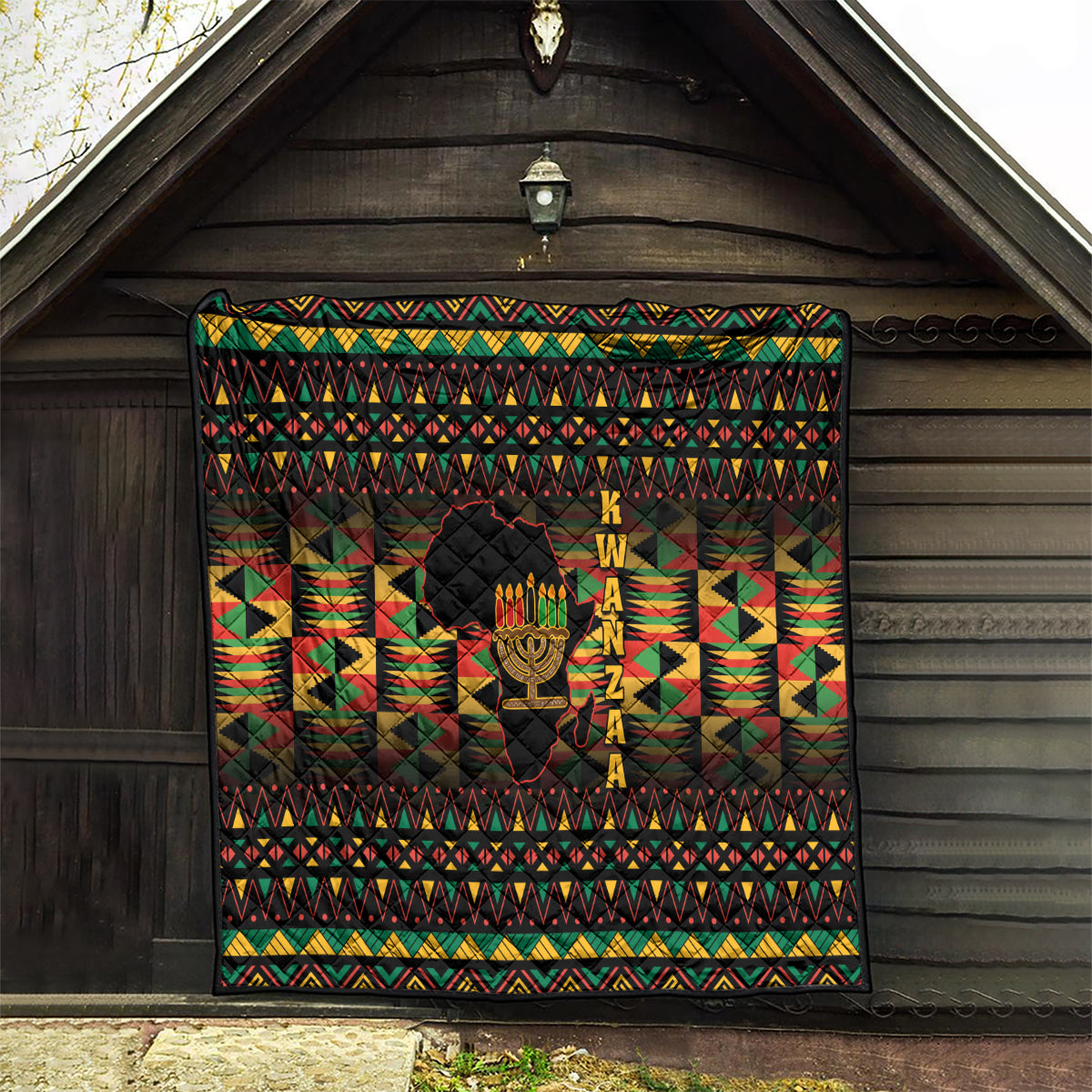 Kwanzaa festival quilt wall hanging with kinara candle art and geometric border in red, green
