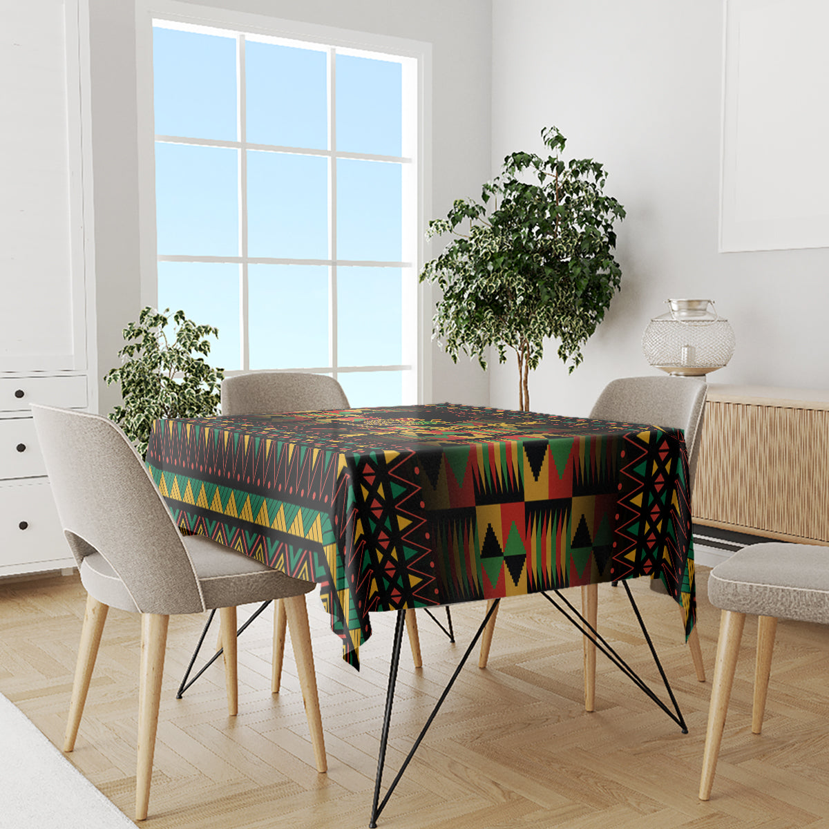 Kwanzaa festival tablecloth in multicolor African pattern on dining table, black base.