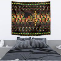 Kwanzaa tapestry featuring kinara candle silhouette and multicolor African geometric bands