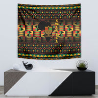 Kwanzaa tapestry with kinara candle motif, K W A N Z A letters, and geometric pattern