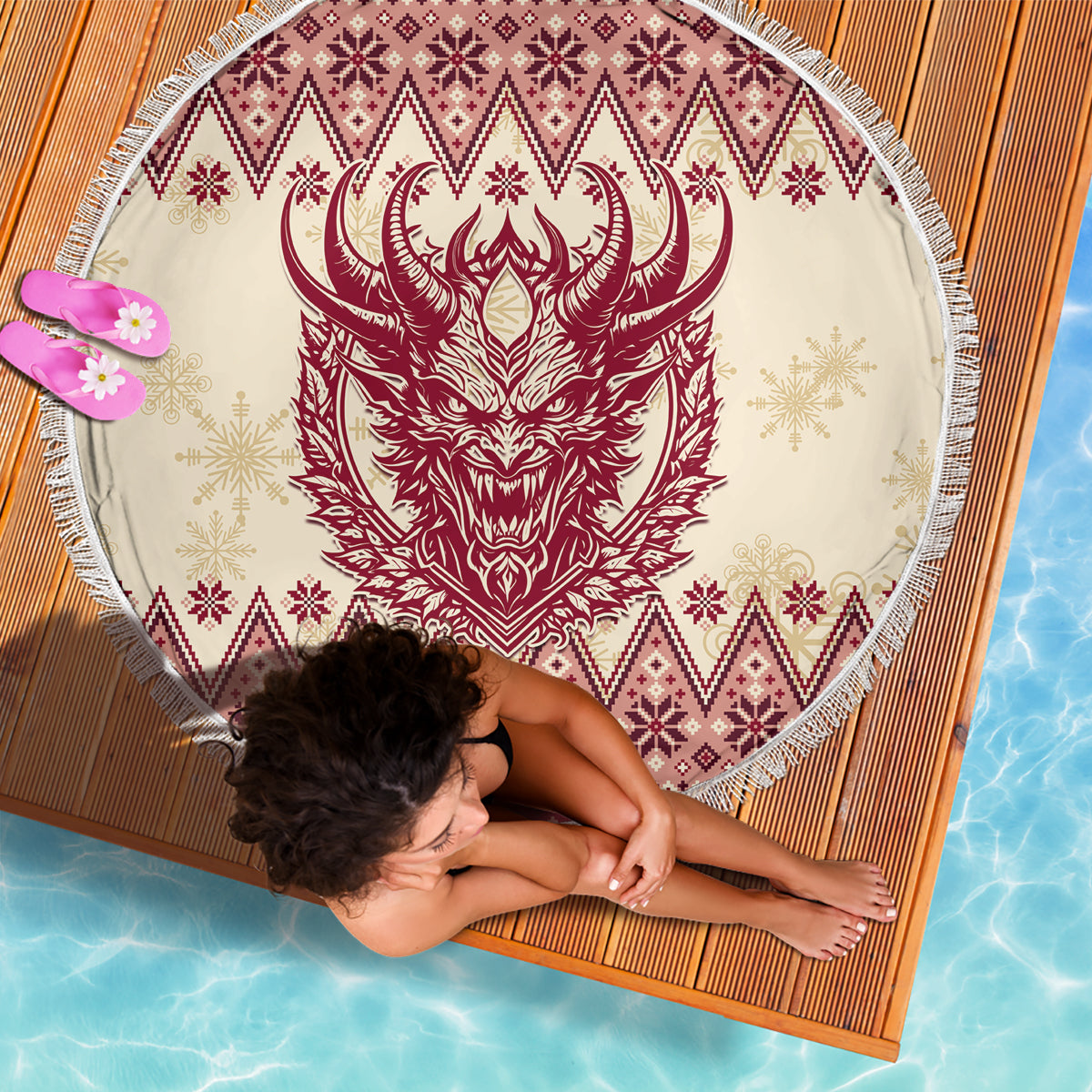 Round beach blanket flat view: red Krampus head, snowflake accents, diamond pattern, white fringe