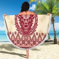 Round beach blanket held open: red Krampus head, snowflake and diamond pattern, white fringe