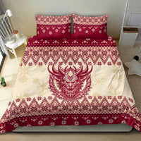 Red and cream Christmas bedding set featuring large Krampus devil face and snowflake patterns