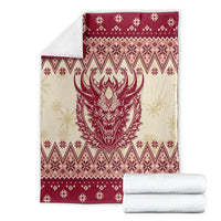 Red and cream Krampus Christmas blanket neatly folded with Nordic patterns