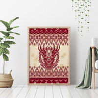 Framed canvas wall art with red Krampus head over cream background and repeating Xmas motifs