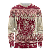 Red and cream long sleeve shirt with central Krampus-style demon face holiday print