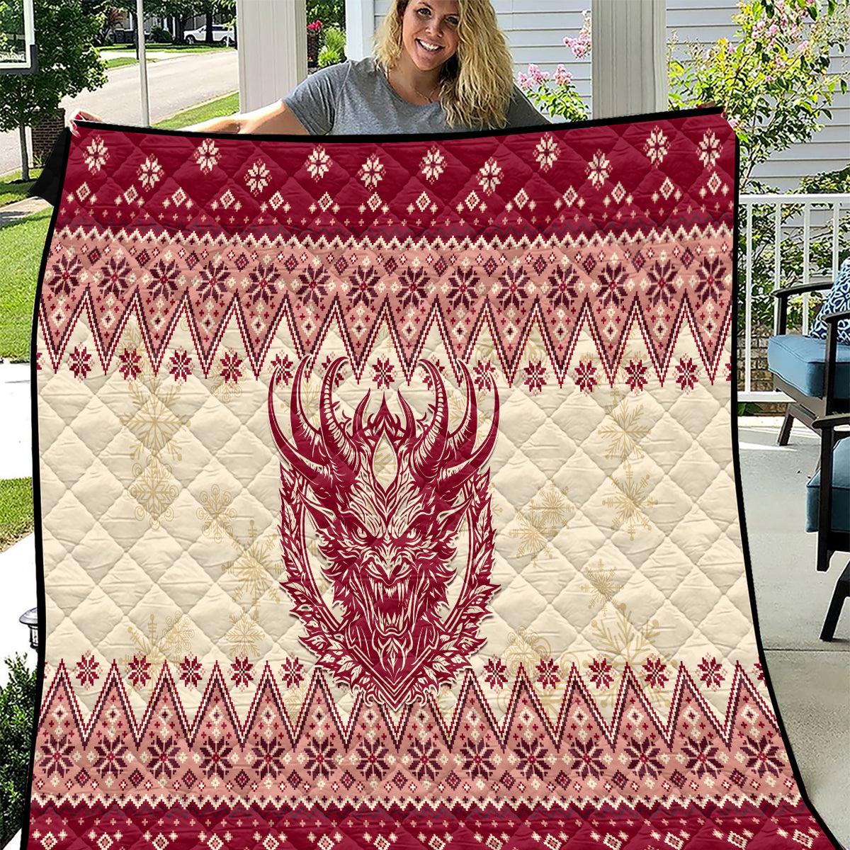 Red and cream quilt with Krampus face, diamond Nordic pattern, quilted stitching detail.