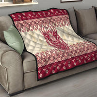 Red and cream quilt draped on couch, centered Krampus face with festive diamond border.