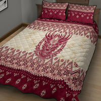 Red and cream quilt bed set with quilted demon graphic and patchwork holiday patterns