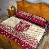 Red and cream quilt bed set with large demon head and diamond holiday pattern