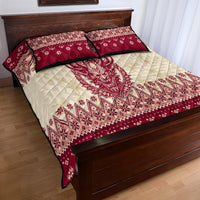 Red and cream quilt bed set with quilted demon head and zigzag holiday motifs