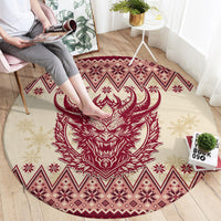 Round area rug featuring a red Krampus horned face with snowflake and diamond patterned trim
