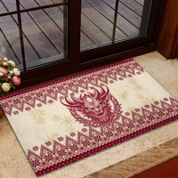 Red rubber doormat with Krampus head center and zigzag holiday border