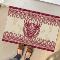Red rubber doormat with Krampus head and winter motif border