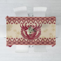 Red Christmas tablecloth with Krampus head and festive geometric border pattern