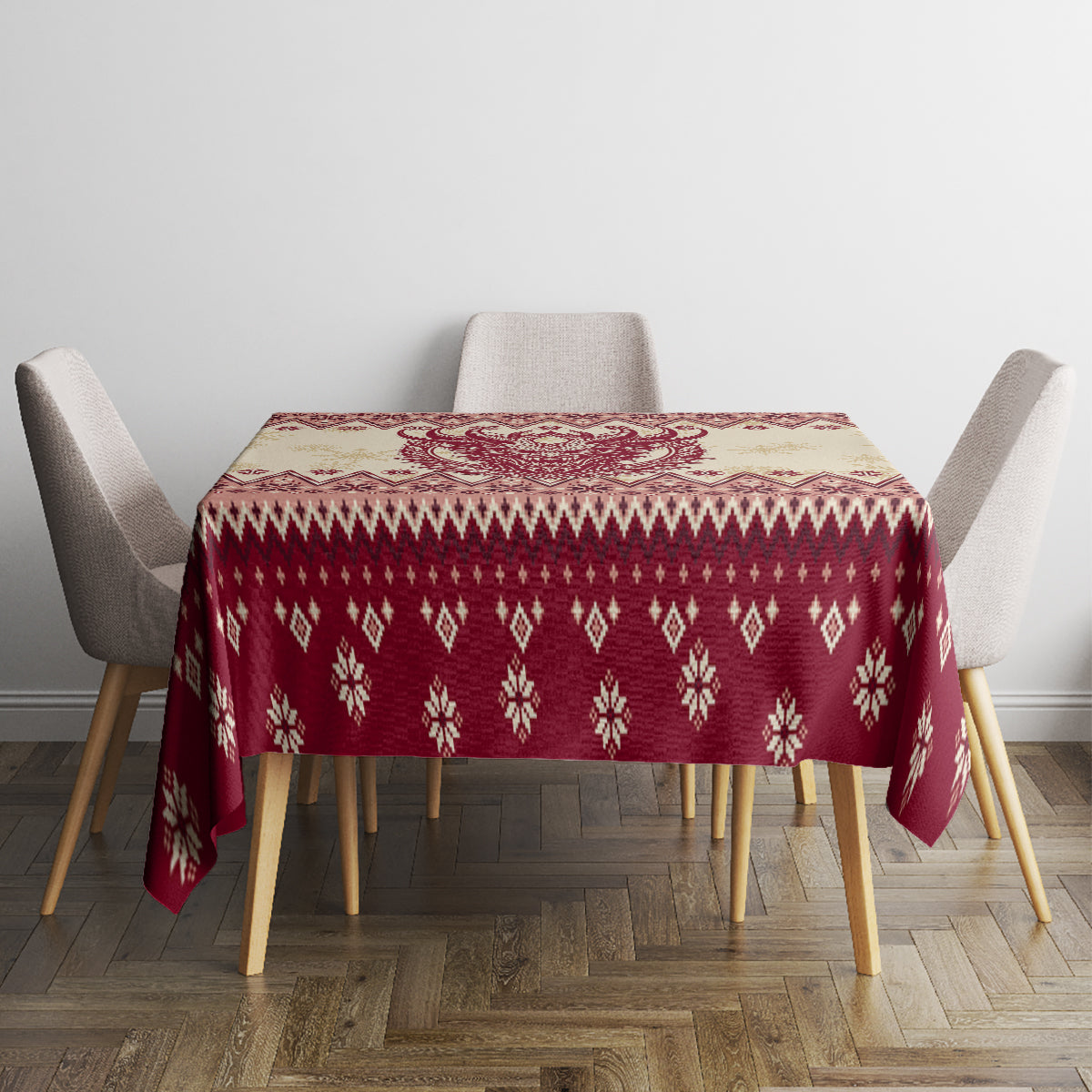 Red Christmas tablecloth with snowflake and diamond knit-style pattern around the edge