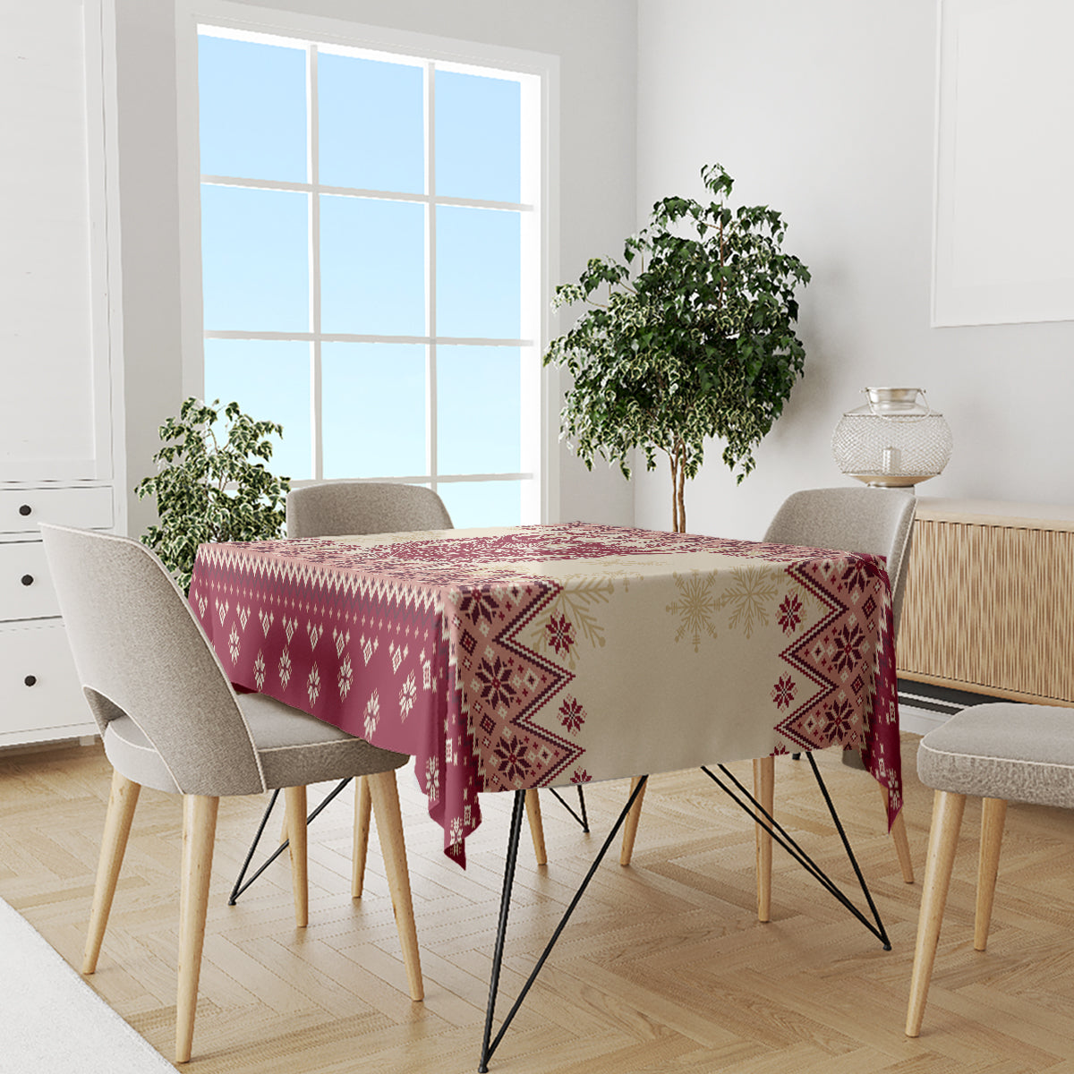 Red Christmas tablecloth with geometric snowflake border pattern on dining table