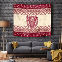 Christmas tapestry with red-and-cream folk pattern and centered horned Krampus face