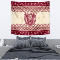 Christmas tapestry hung on wall, red-and-cream geometric border with horned Krampus face