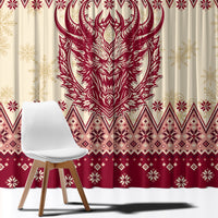 Close-up red and cream Christmas curtain fabric with large horned Krampus head graphic