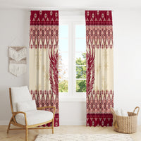 Full view of red and cream Christmas curtain panels with horned Krampus silhouette and snowflakes
