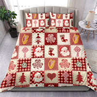 Red patchwork Christmas quilt with pillow set, featuring Santa, tree, heart, and candy motifs
