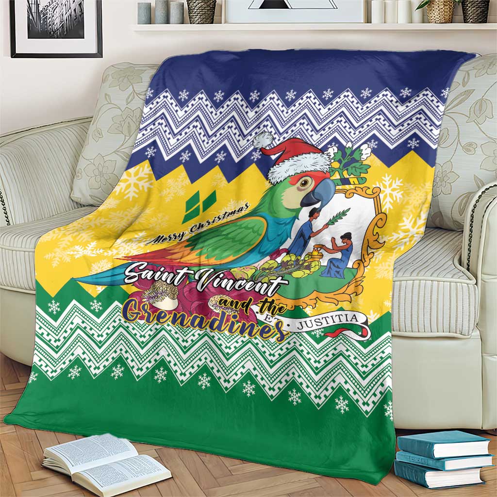 Folded out Christmas blanket with parrot illustration, Santa hat, and blue-yellow-green chevrons