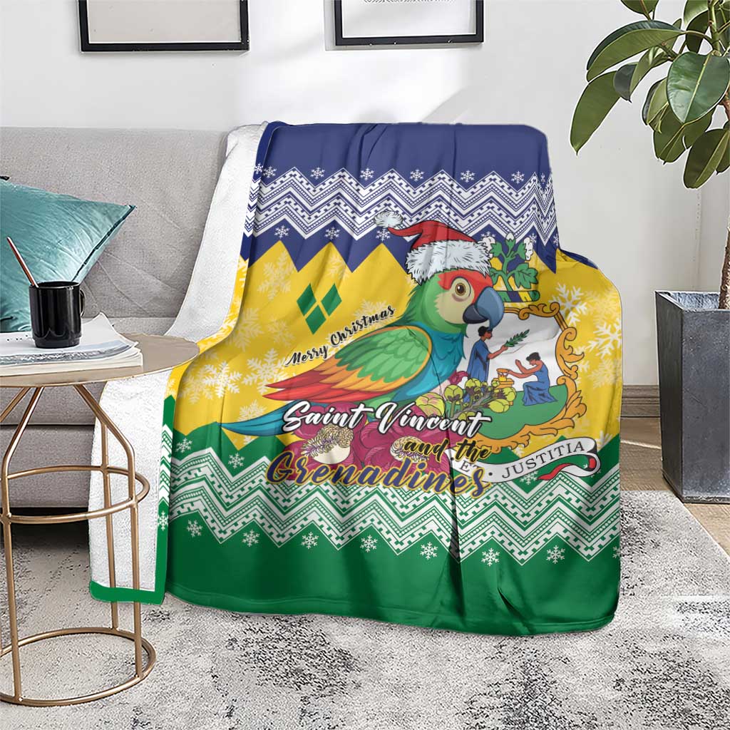 Christmas blanket draped on a chair with green, yellow and blue zigzag border and parrot