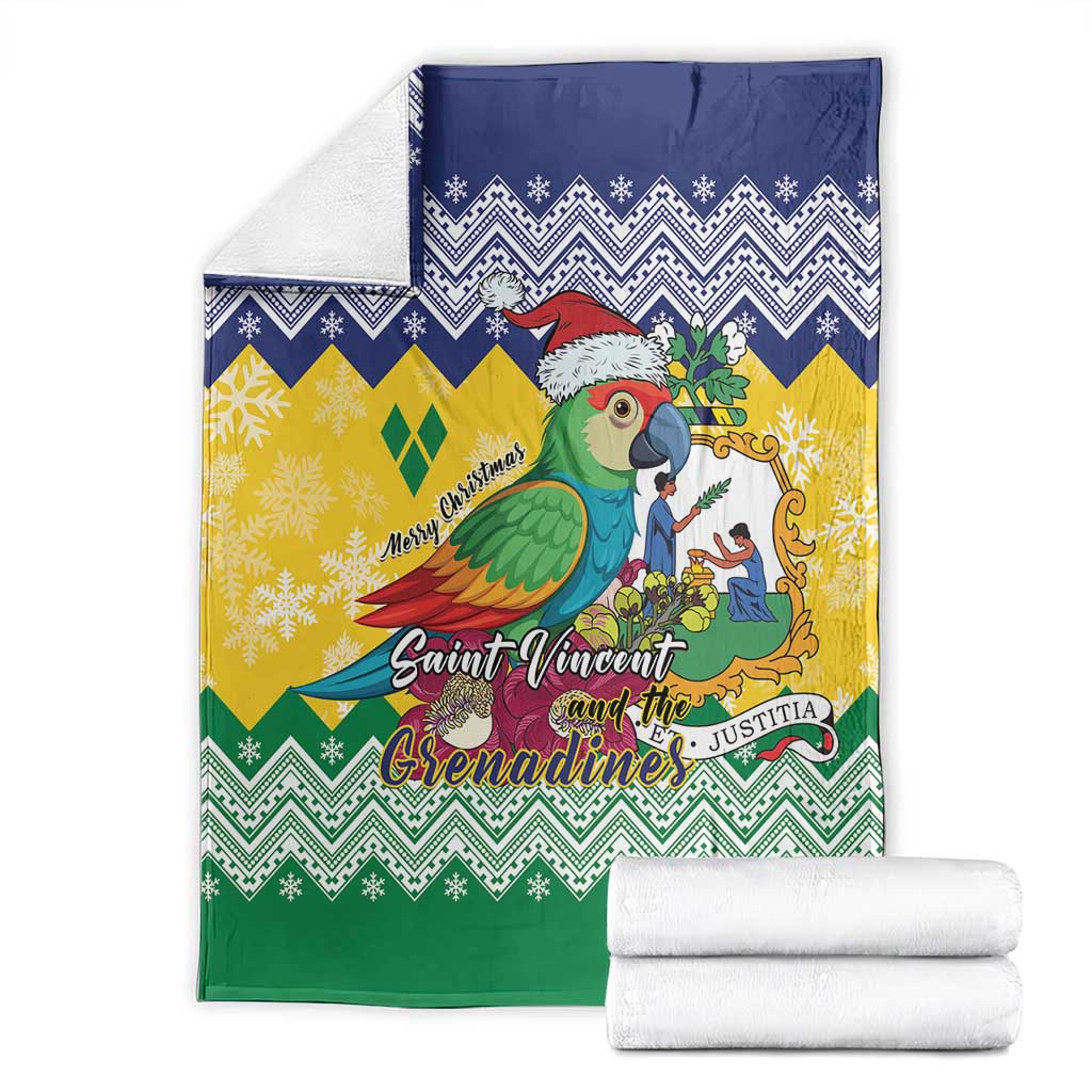 Folded Christmas blanket with parrot artwork and blue, yellow and green zigzag design