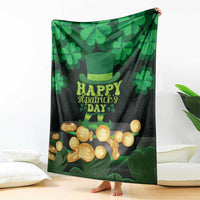 St Patrick's Day blanket draped on bed, dark green/black with shamrocks, hat, and gold coins