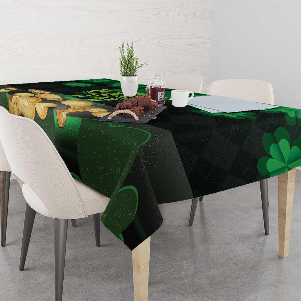Green St Patrick’s Day tablecloth with shamrocks and gold coins on table surface