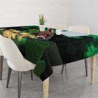 Green St Patrick’s Day tablecloth with shamrocks and gold coins on table surface