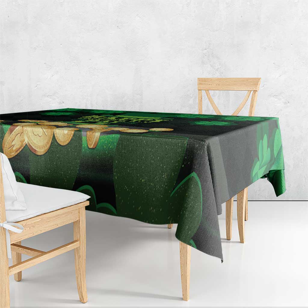 Green and black patterned tablecloth with shamrocks and coin motifs on table edge