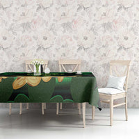 Green tablecloth with shamrocks and gold coin motifs on dining table