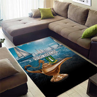 Blue and black rectangular area rug with sailboat graphic across center