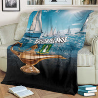 Folded blue and black throw blanket showing “Virgin Islands” logo and golden lamp